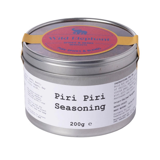 Wild Elephant Piri Piri Seasoning by Whole Food Earth in a spice jar with vibrant red seasoning and label.