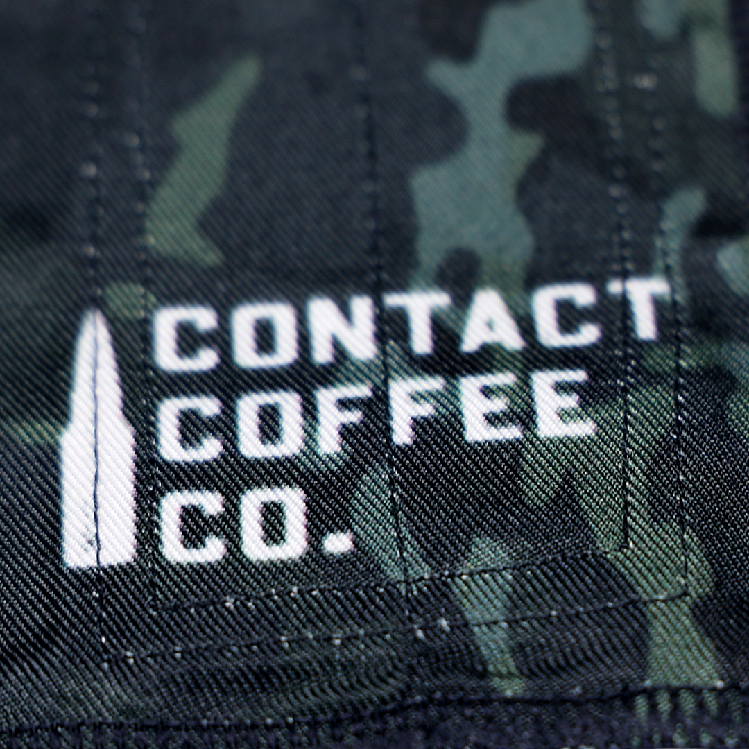 Close-up of Camo Gym Wrist Wraps by Contact Coffee Company Ltd., showing the camouflage design and durable strap details.