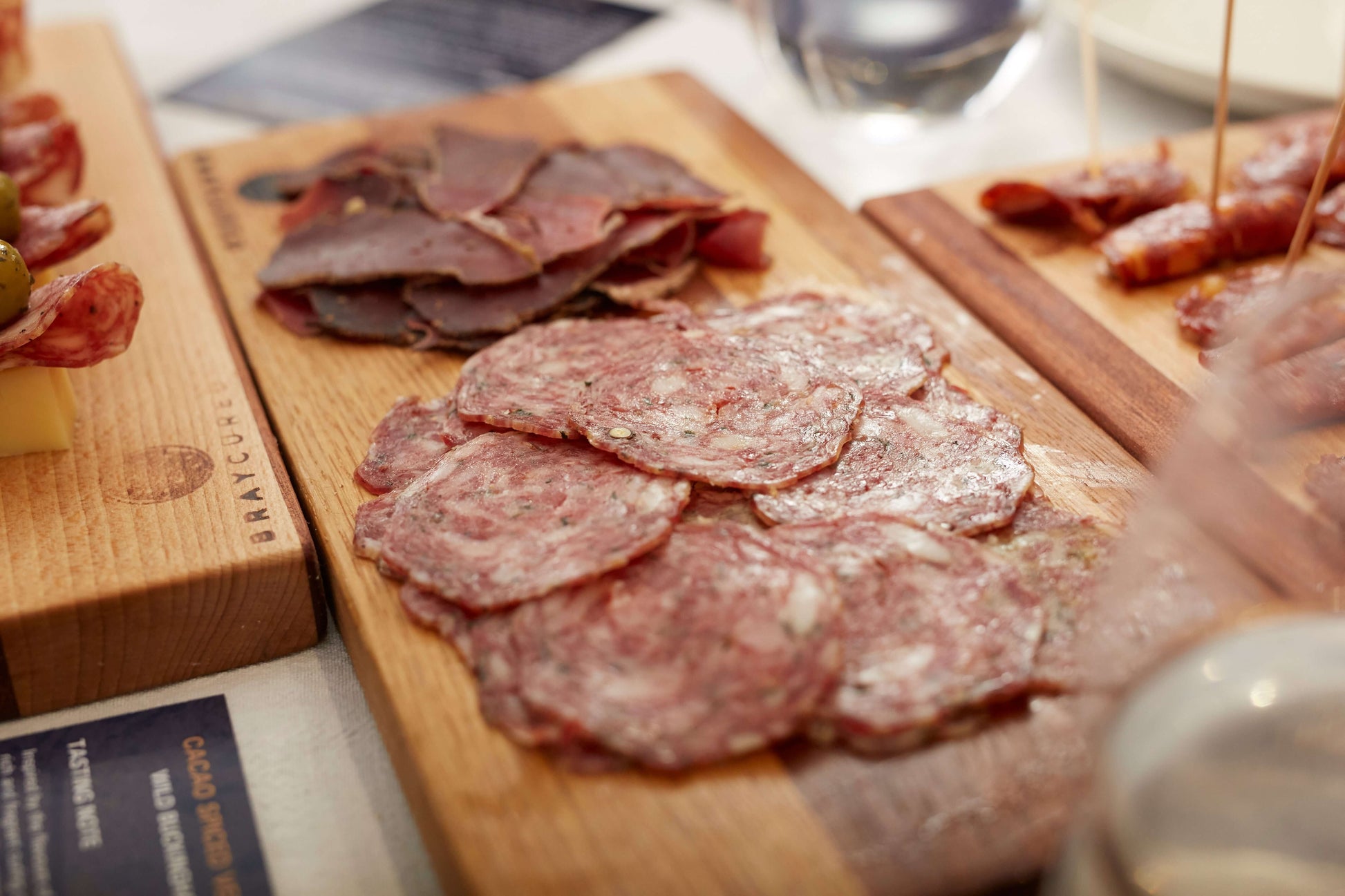 Assorted cured meats and cheeses on a charcuterie board with Bray Cured Charcuterie Course Preview Pack selection.