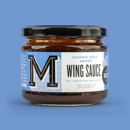 Manfood Filipino Style Adobo Wing Sauce in a bottle, rich and savory sauce perfect for wings and Filipino dishes.