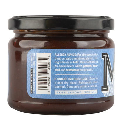 Manfood Adobo Wing Sauce in a bottle, showcasing its rich, flavorful sauce ideal for wings and grilling.