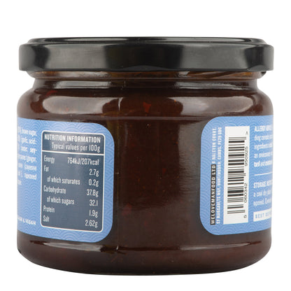 Bottle of Manfood Adobo Wing Sauce with label visible, showcasing the spicy, flavorful sauce for wings and marinades.