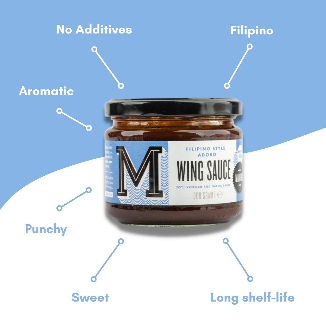 Bottle of Manfood Filipino Style Adobo Wing Sauce showing the label and dark sauce inside the glass bottle.