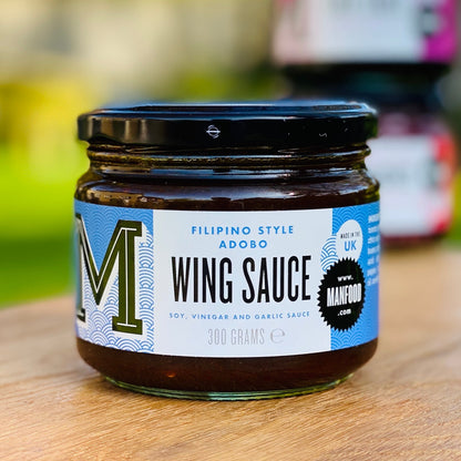 Manfood Adobo Wing Sauce in a jar, showcasing a rich, dark sauce with a smooth texture, ideal for wings and marinades.