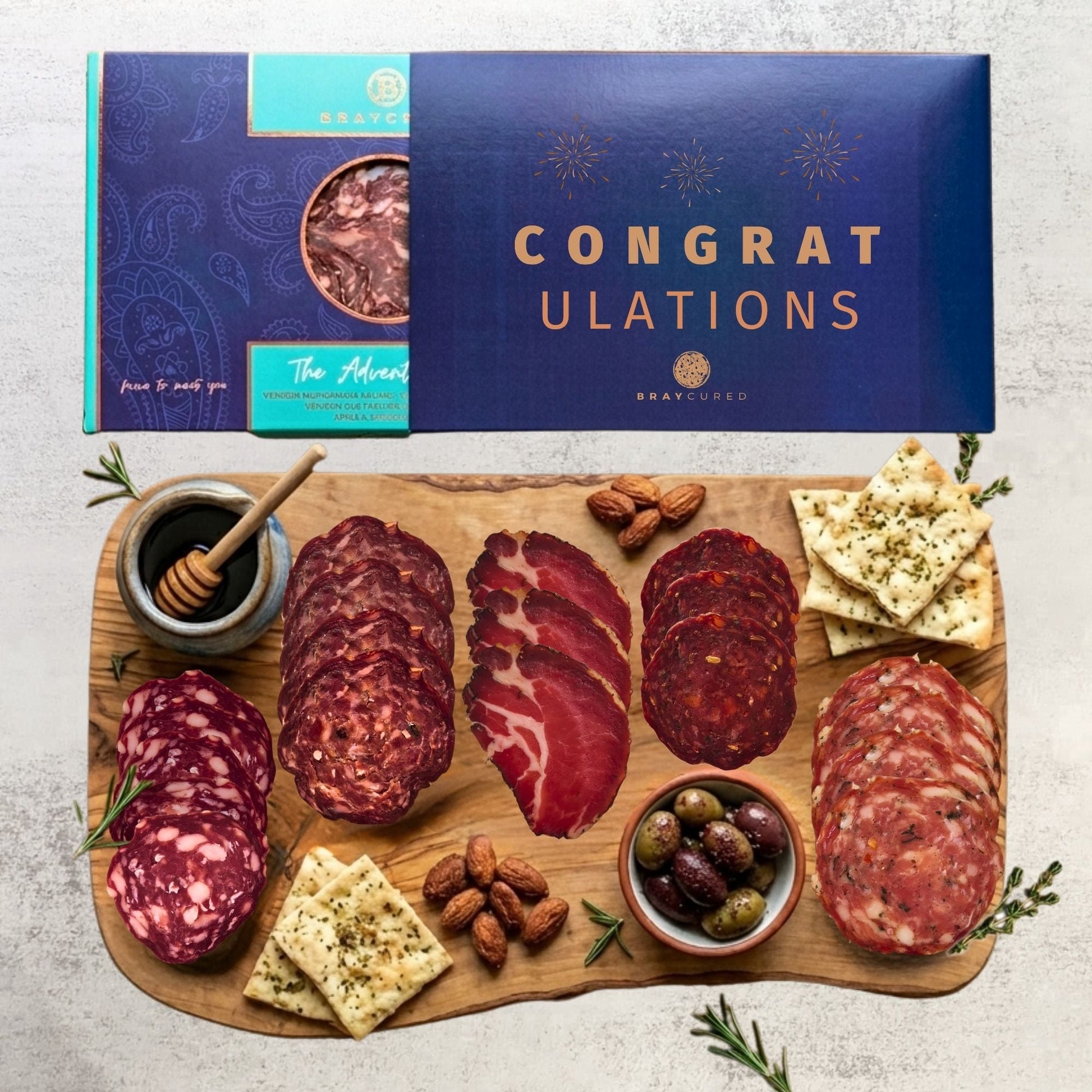 Bray Cured Adventure Feasting Five charcuterie selection on a wooden platter with festive Christmas sleeve.
