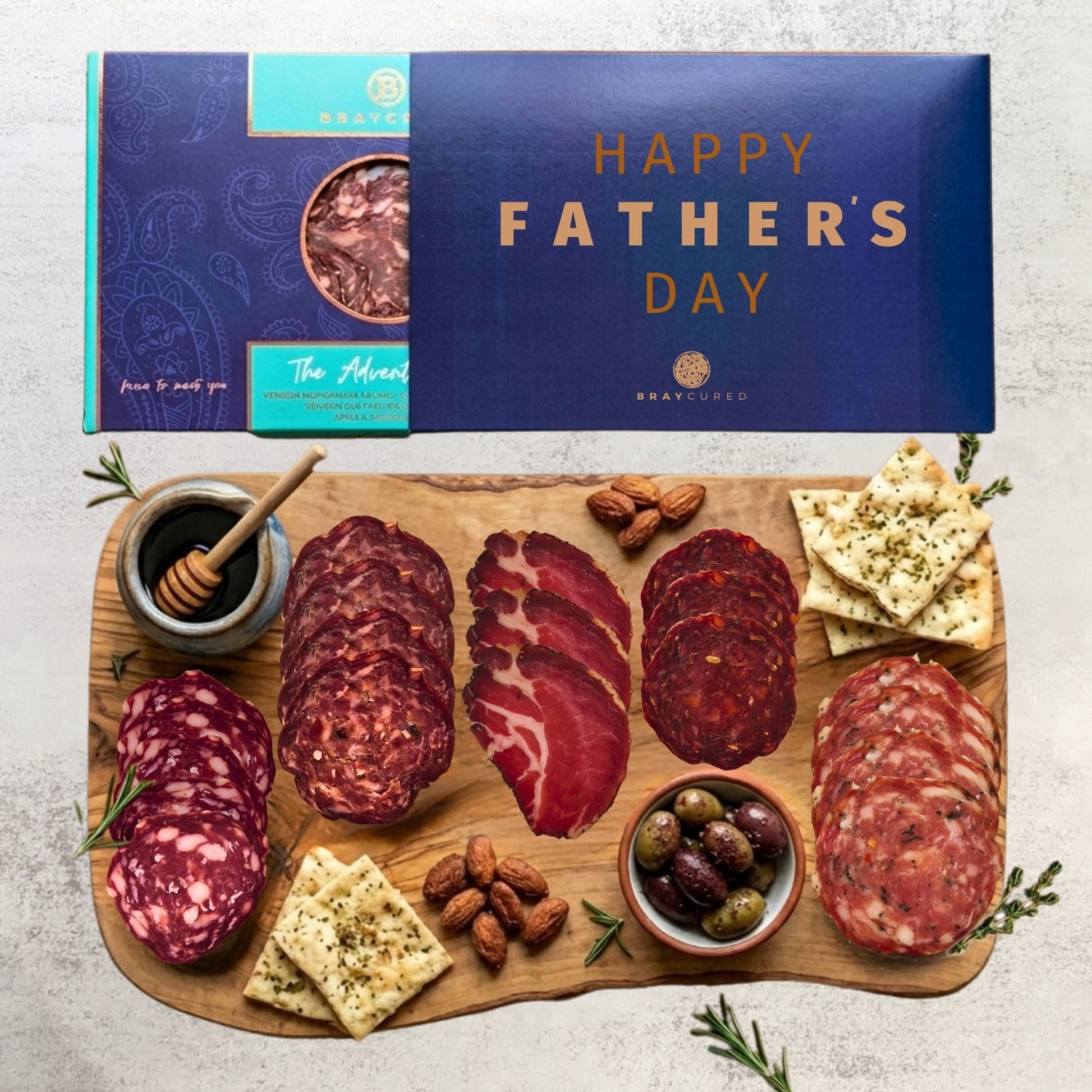 Bray Cured Adventure Feasting Five charcuterie selection on a wooden board with festive Christmas sleeve, ready for sharing.