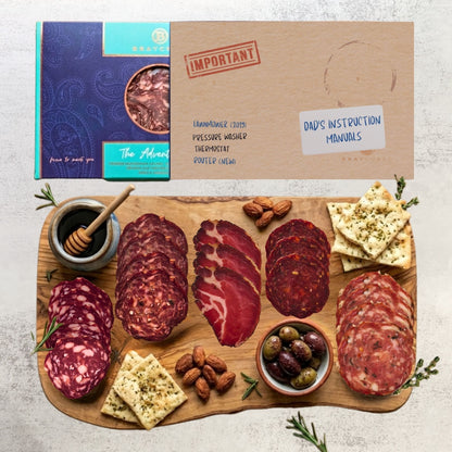 Bray Cured Adventure Feasting Five charcuterie selection on a wooden board with festive Christmas sleeve.
