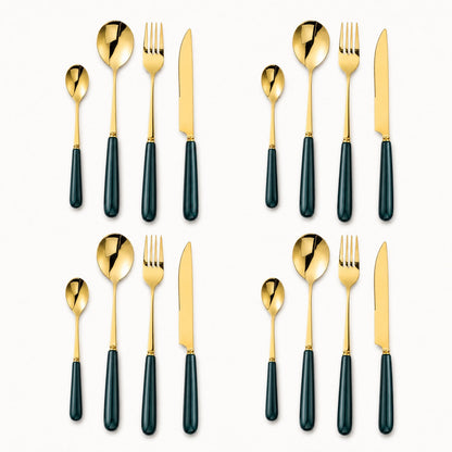 KitchBoom Aldermere 16-piece gold cutlery set with forest green handles, including knives, forks, and spoons arranged on a table.