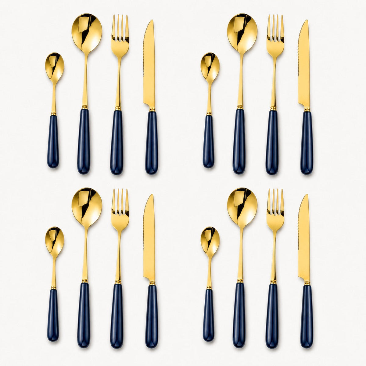 A 16-piece gold cutlery set by KitchBoom with midnight navy handles, including forks, knives, spoons, and teaspoons arranged on a table.