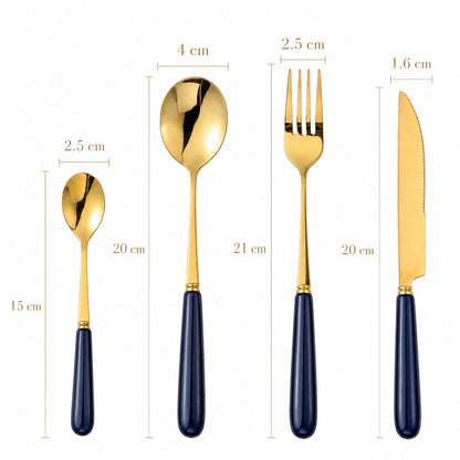 Aldermere 16-piece gold cutlery set by KitchBoom in midnight navy, including forks, knives, spoons, and teaspoons, arranged on a table.