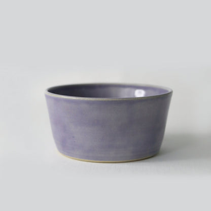Amethyst purple ceramic breakfast bowl by Katie L Thompson Designs, featuring a smooth round shape and glossy finish.