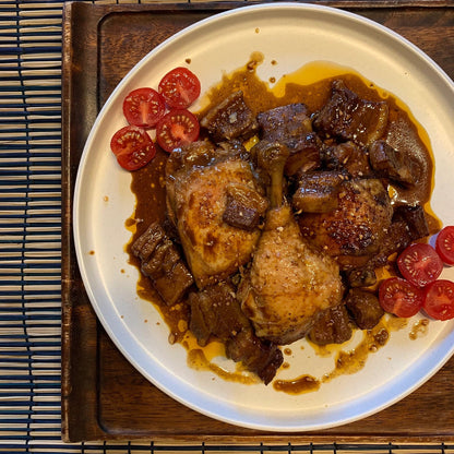 RoniBs Kitchen Filipino style adobo sauce bottle, rich and savory condiment for Philippine cuisine, shown in a close-up image.