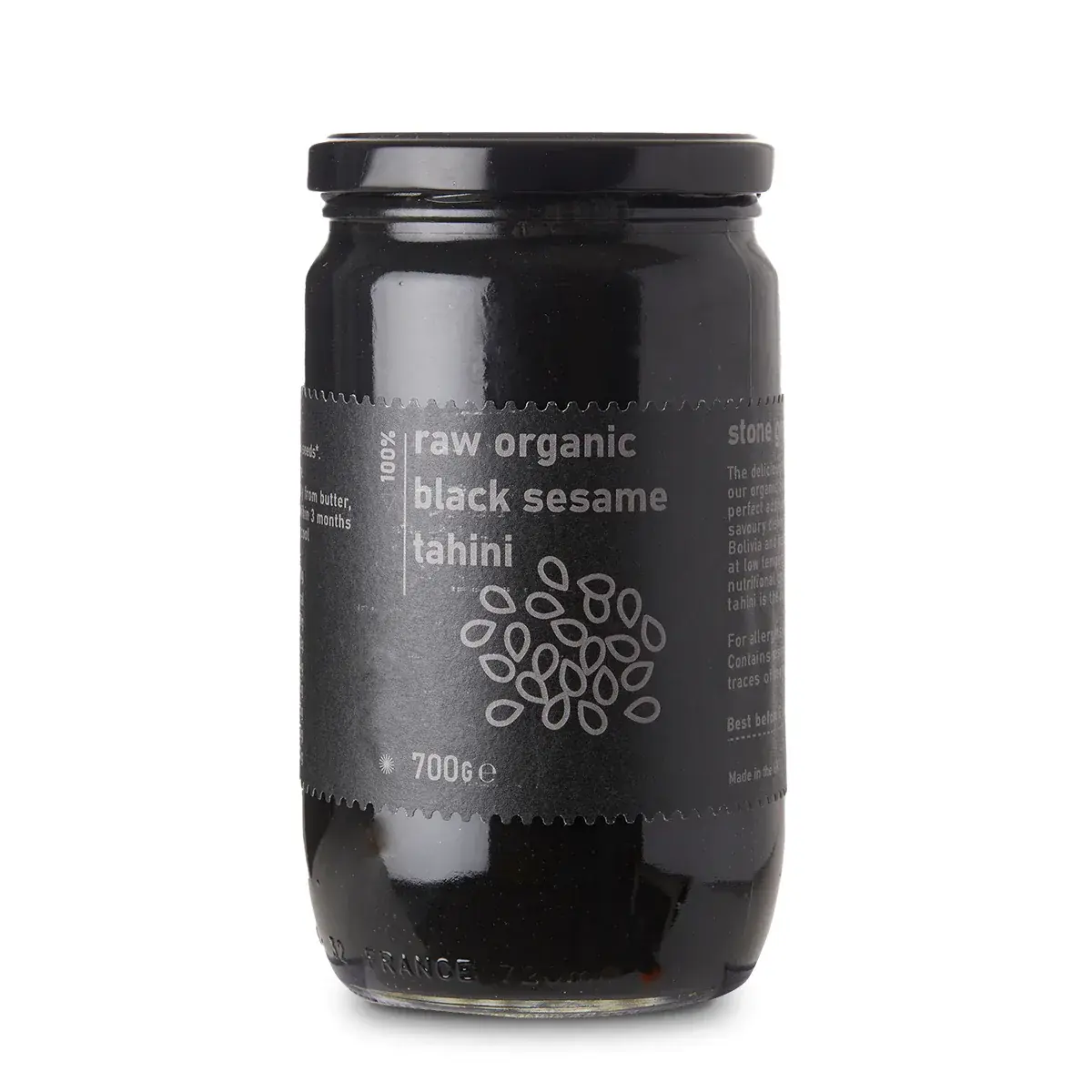 Raw Organic Black Sesame Tahini from Whole Food Earth, a creamy black sesame spread in a glass jar with a natural, textured surface.
