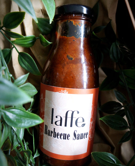 Bottle of Laffe Barbecue Sauce surrounded by green leaves