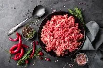 Fresh Primrose Herd lean beef mince in a 500g package, showing finely ground, bright red beef ready for cooking.