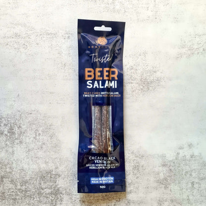 Bray Cured Beer Salami charcuterie pack featuring cacao, black venison, and slices of beer-infused salami on a wooden board.