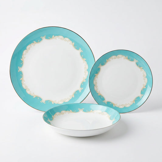KitchBoom Belmont 12-piece fine bone china dinner set with matching plates, bowls, and cups on a dining table.