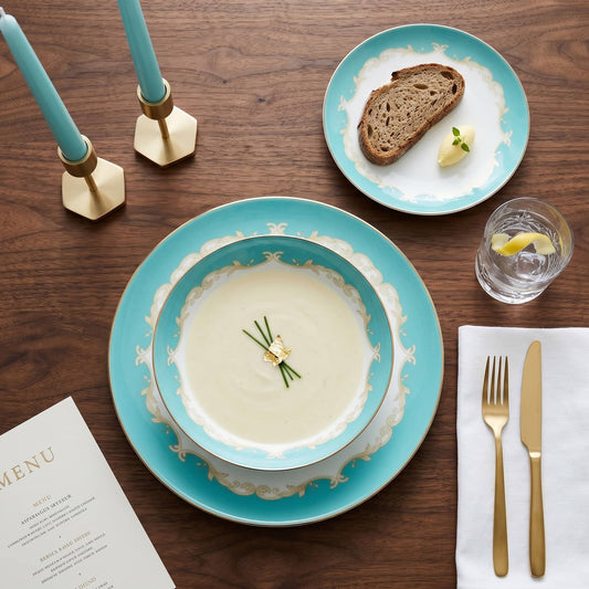 KitchBoom Belmont 12-piece fine bone china dinner set arranged on a styled table with plates, bowls, and cups.