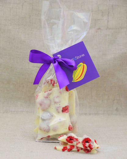 Handmade white chocolate and raspberry berry delicious dessert from Gorvett & Stone, featuring fresh berries and creamy white chocolate.