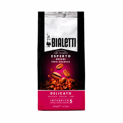 Bialetti Whole Bean Coffee by Brew Italia with whole roasted coffee beans in a clear bag, showcasing the Delicato blend.