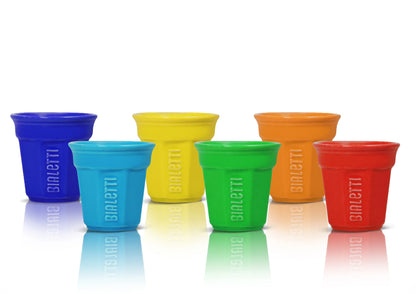 Set of six Bialetti espresso cups in various colors, made by Brew Italia, displayed on a wooden surface.