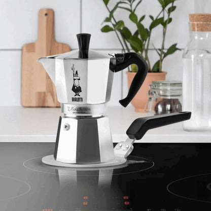Bialetti induction plate from Brew Italia, compact black hardware for compatible stoves, with a sleek, minimal design.