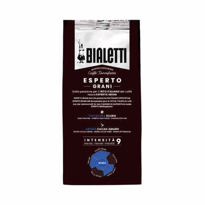 Bialetti Intenso coffee beans from Brew Italia, whole beans with dark roasted surface and rich aroma, in a clear bag.