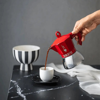Bialetti Moka Induction Exclusive coffee maker from Brew Italia with sleek stainless steel design and induction-compatible base.