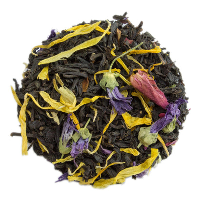 Blue Lady flavoured black tea by PekoeTea Edinburgh, showing a vibrant blue and black tea blend in a clear glass cup.