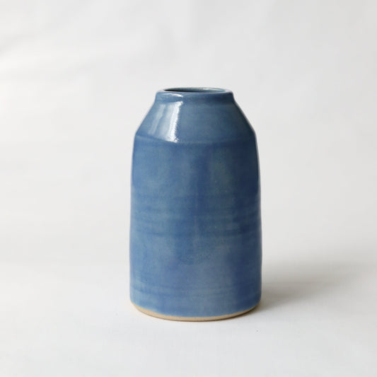 Pacific Blue Classic Bud Vase by Katie L Thompson Designs, featuring a sleek blue ceramic design on a white background.
