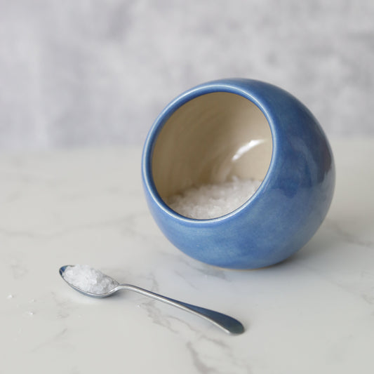 Pacific Blue Classic Salt Pig by Katie L Thompson Designs with a spoon, featuring a square shape and vibrant blue ceramic finish.