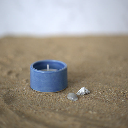 Square Pacific Blue tea light holder by Katie L Thompson Designs, featuring a modern ceramic design for ambient lighting.