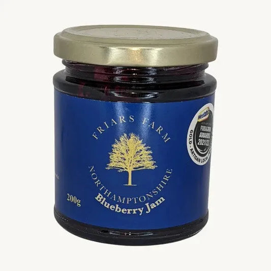 Jar of Friars Farm Blueberry Jam, 200g, with fresh blueberries and a spreadable texture visible in the image.