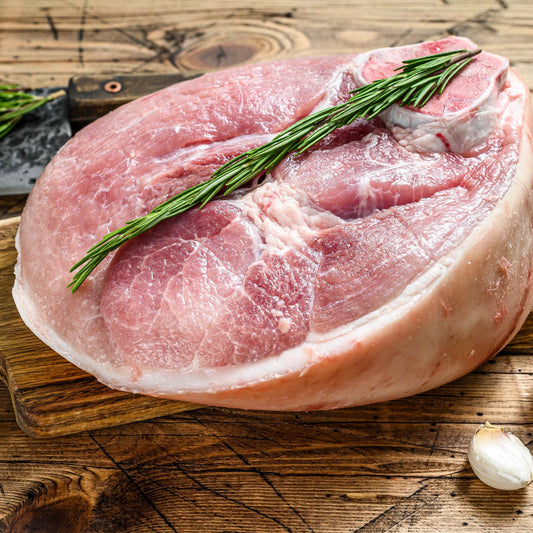 Bone-in Gammon joint from Primrose Herd, showcasing a fresh, raw gammon cut with bone attached, ready for cooking.