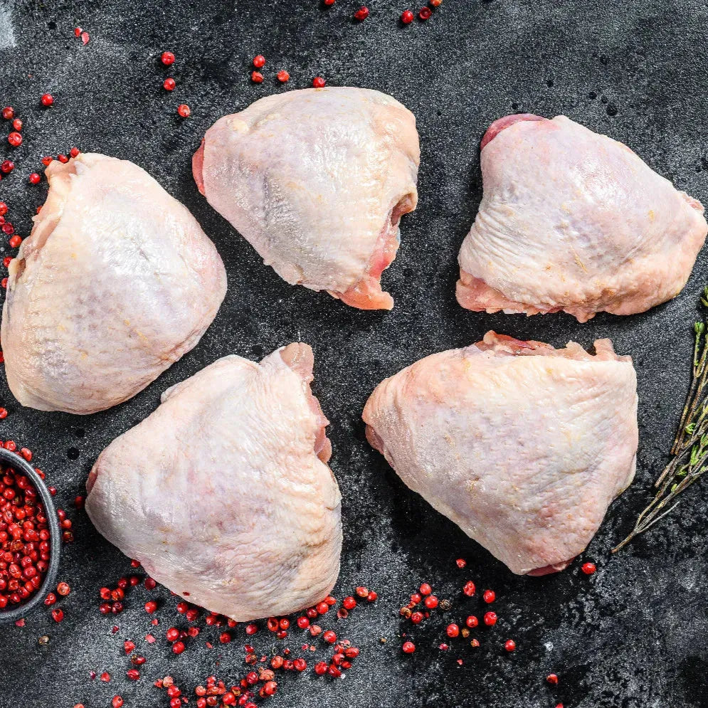 Primrose Herd Creedy Carver free-range boneless chicken thighs, raw and skinless, ready for cooking or grilling.