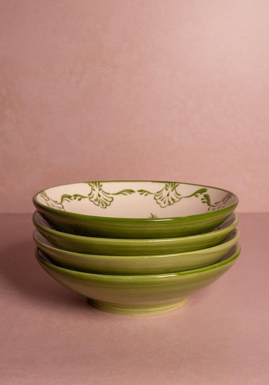 Set of four green Cara Shell Pasta Bowls by Casa by Josephine Jenno, showcasing their shell-shaped design and vibrant color.