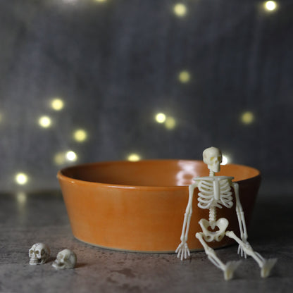 Mandarin orange ceramic pasta bowl by Katie L Thompson Designs, featuring a classic round shape and vibrant orange pattern.