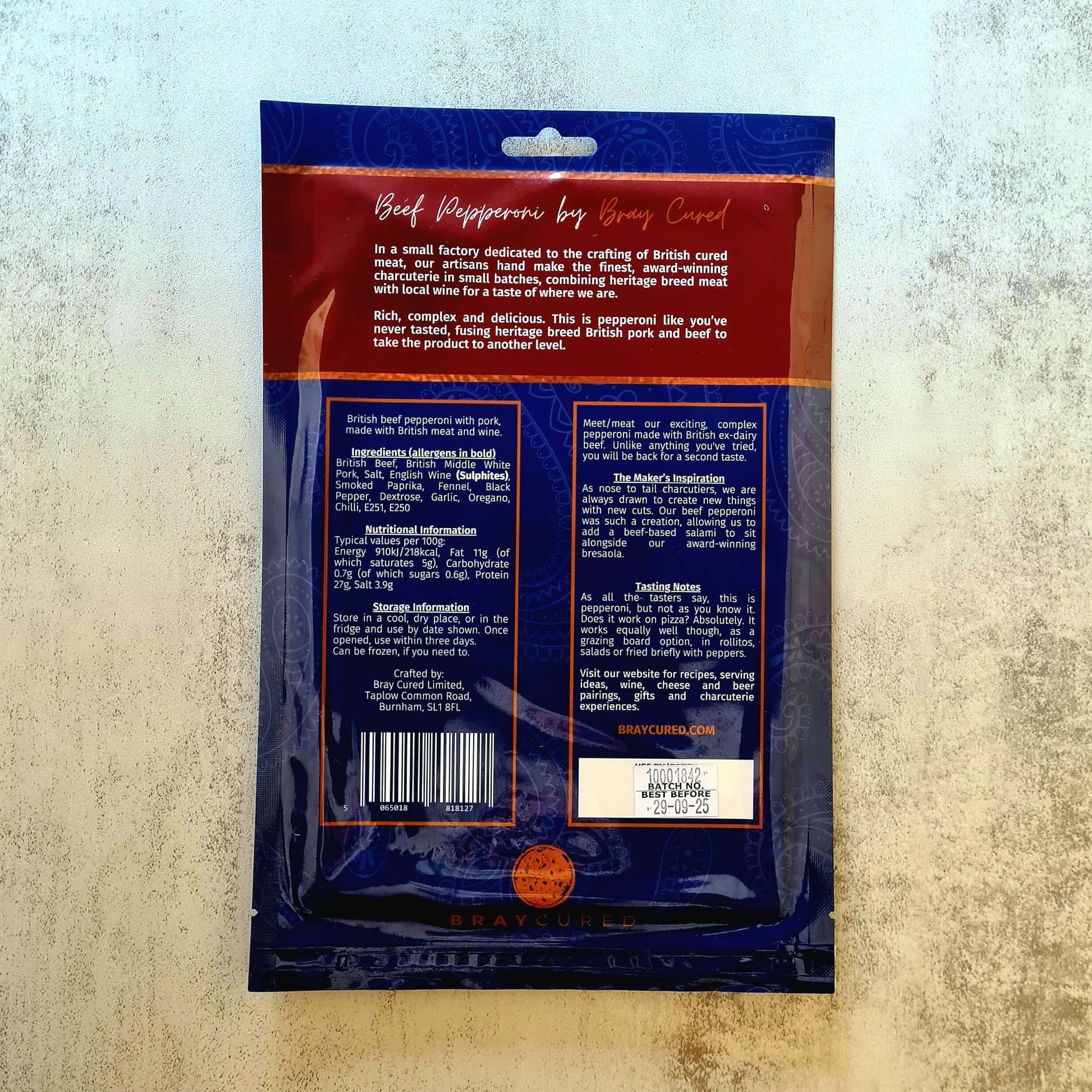 Back view of Bray Cured British Pepperoni charcuterie pack, showing slices of seasoned beef pepperoni in a resealable package.