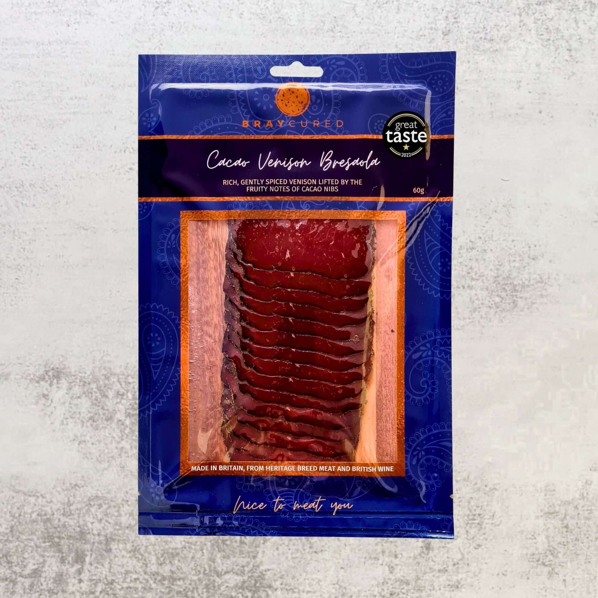 Thin slices of Cacao-Spiced Venison Bresaola from Bray Cured charcuterie pack, showcasing rich, dark cured venison with cacao accents.