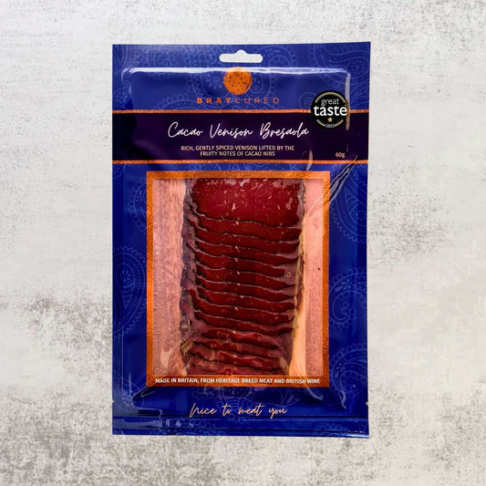 Thin slices of Cacao-Spiced Venison Bresaola from Bray Cured charcuterie pack, showcasing rich, dark cured venison with cacao accents.