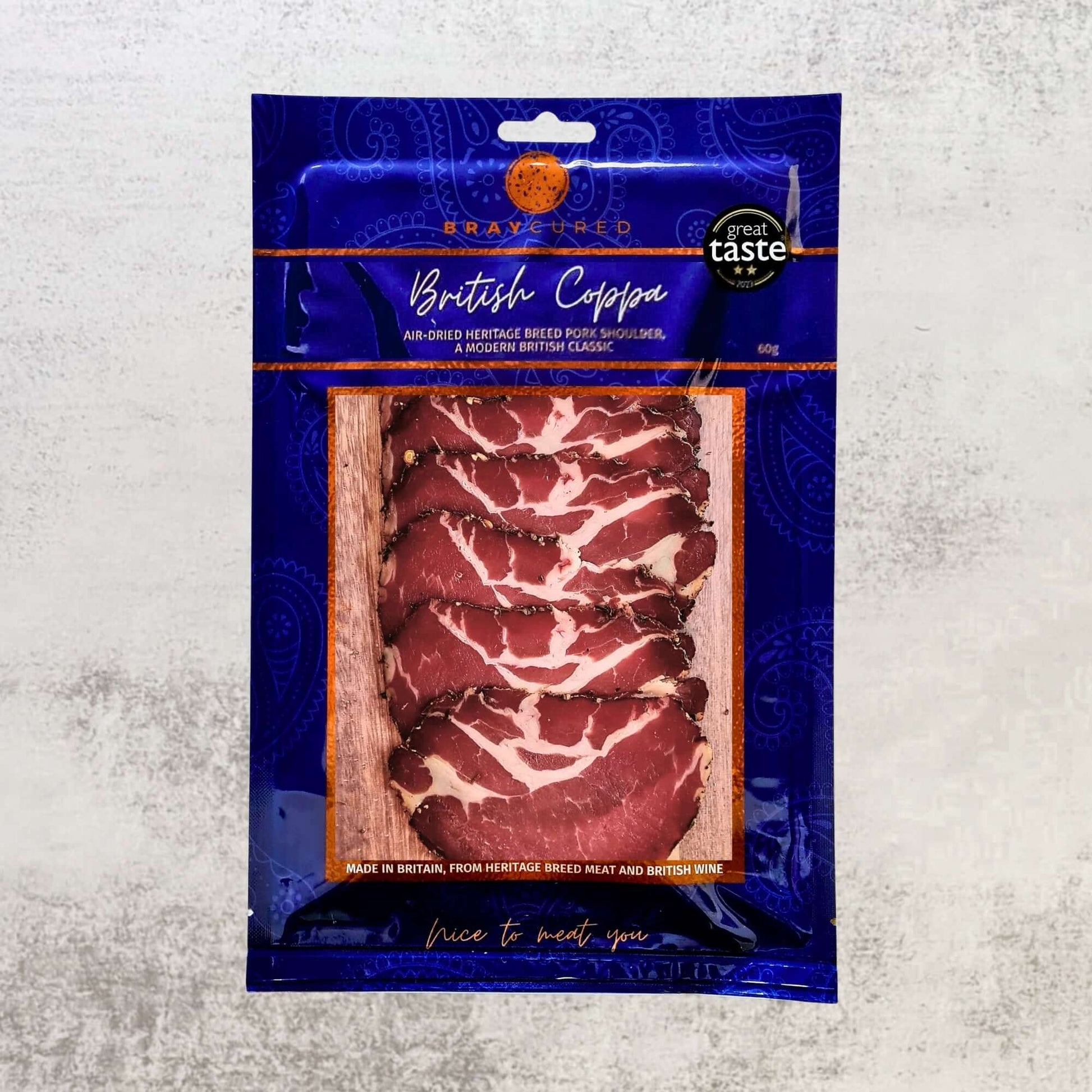 Thin slices of Bray Cured Air-Dried Coppa, a premium British charcuterie meat with marbled texture and rich flavor.