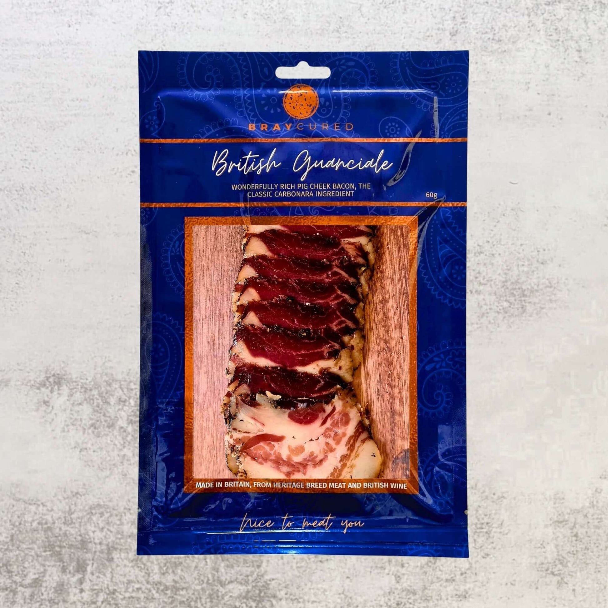 Bray Cured British Guanciale charcuterie pack with slices of cured pork cheek on a white surface.