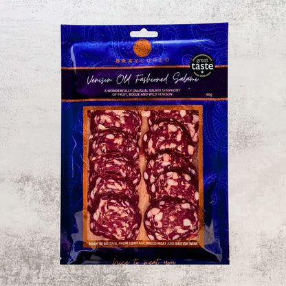 Sliced Bray Cured Venison Old Fashioned Salami on a wooden board, showcasing its rustic charcuterie style and rich, cured texture.