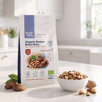 Broken Brazil nuts from Whole Food Earth, organic nuts and seeds, showing the textured, split nut pieces on a neutral background.