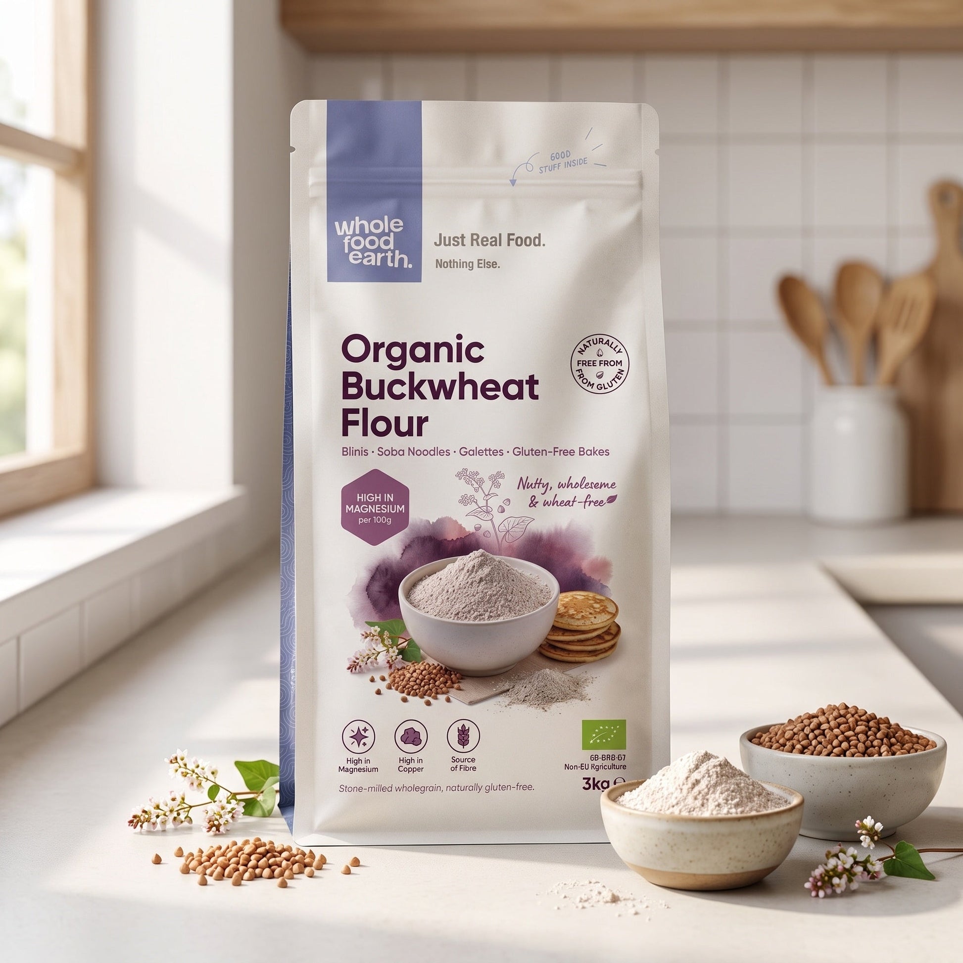 Organic Buckwheat Flour from Serious Grains by Whole Food Earth, shown in a natural setting with a wooden spoon and spoonful of flour.