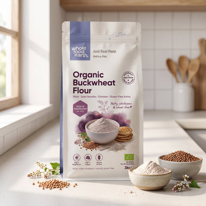Organic Buckwheat Flour from Serious Grains by Whole Food Earth, shown in a natural setting with a wooden spoon and spoonful of flour.