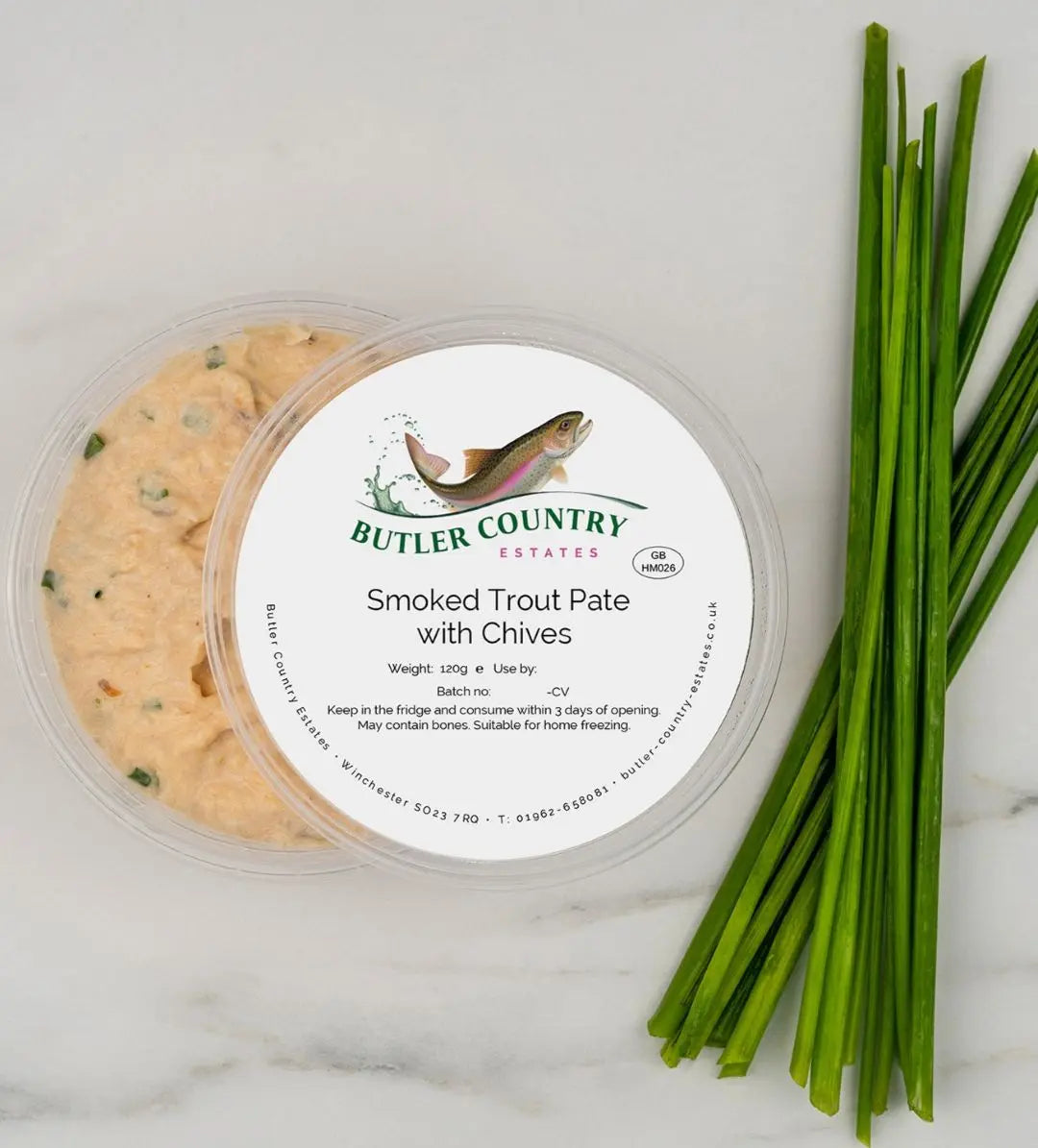 Smoked trout pate with chives in a serving dish, made by Butler Country Estates, perfect for gourmet spreads and appetizers.