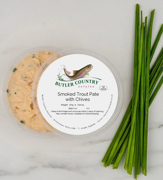 Smoked trout pate with chives in a serving dish, made by Butler Country Estates, perfect for gourmet spreads and appetizers.