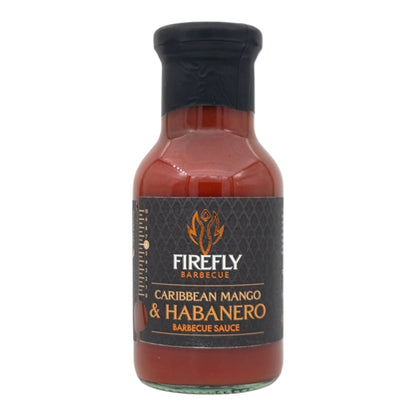 FireFly Barbecue Caribbean Mango Hot Sauce bottle, vibrant label, and spicy mango flavor for BBQ and grilling.