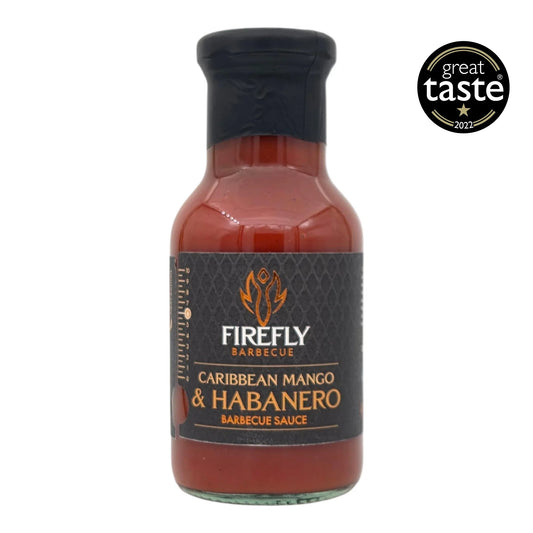 FireFly Barbecue Caribbean Mango Hot Sauce in a bottle with a label featuring tropical mango imagery and award recognition.